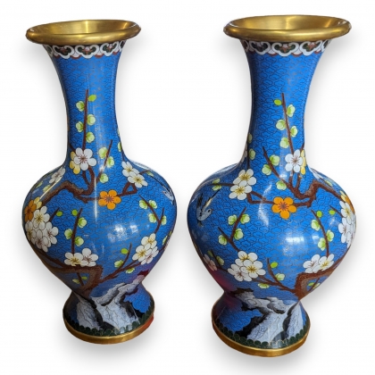 A pair of blue cloisonné vases decorated with cherry trees