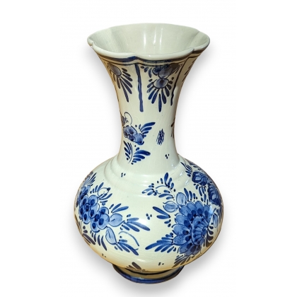 Delft-style earthenware vase with flowers