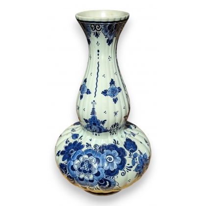 Delft-style earthenware vase with flowers
