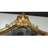 Miroir doré à fronton coquille