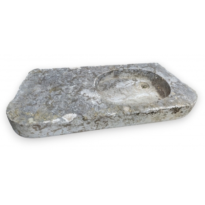 Stone sink with an oval opening