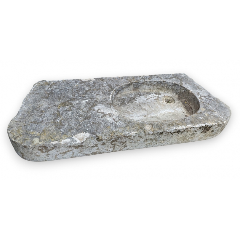 Stone sink with an oval opening