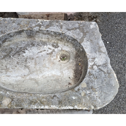 Stone sink with an oval opening
