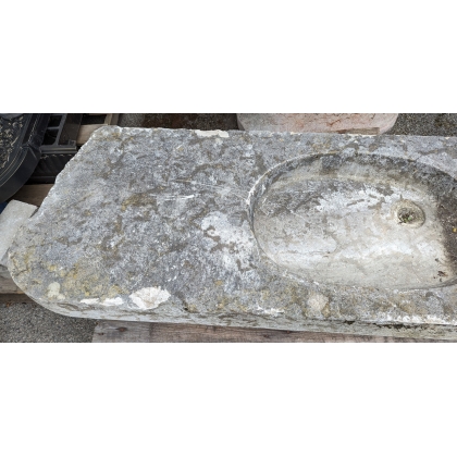 Stone sink with an oval opening