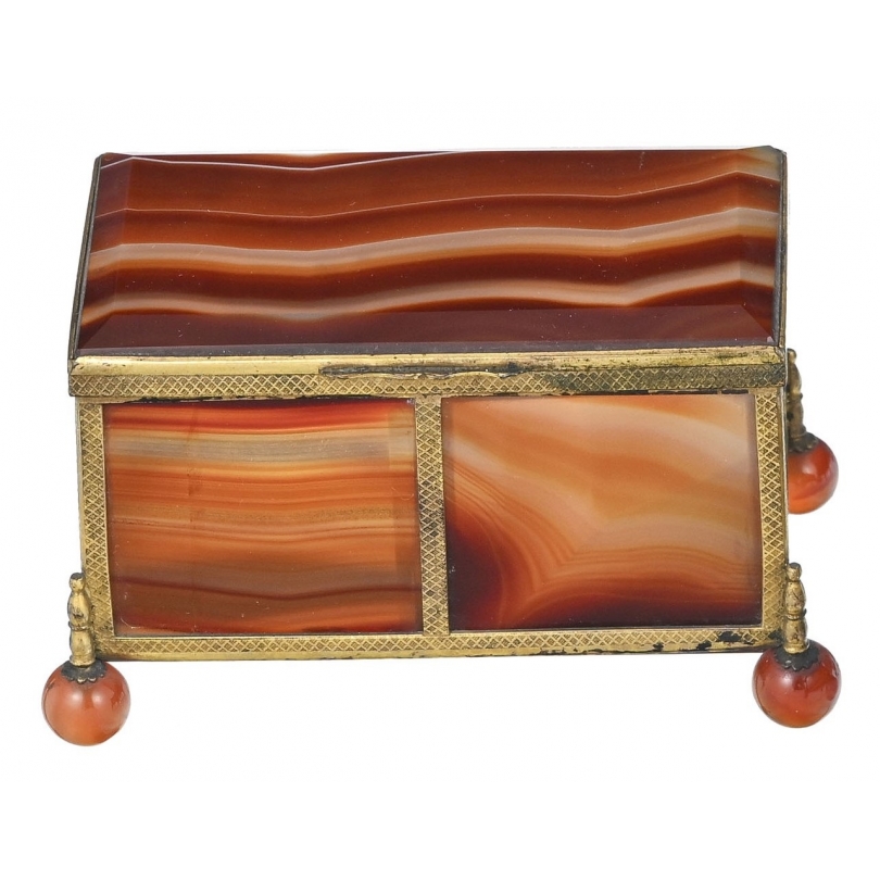 A box shaped like a casket, made of gold and orange metal