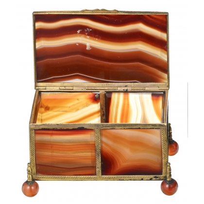 A box shaped like a casket, made of gold and orange metal