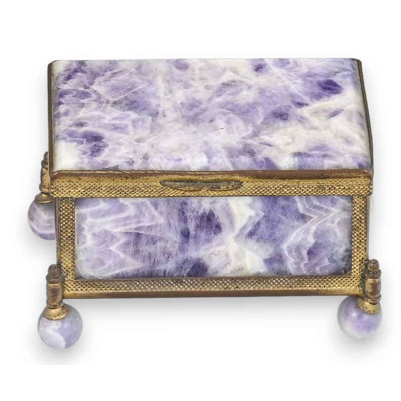 A box shaped like a casket, made of gold and purple metal