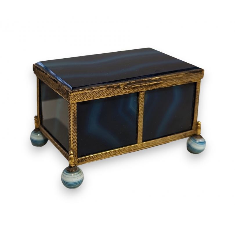 A box shaped like a casket, made of gold and blue metal