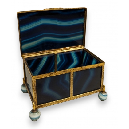 A box shaped like a casket, made of gold and blue metal