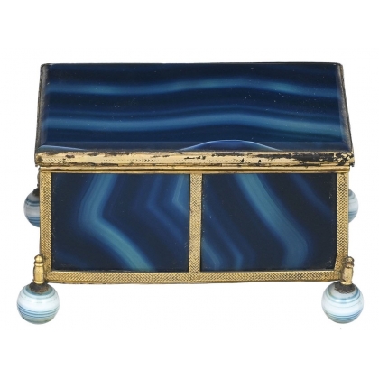 A box shaped like a casket, made of gold and blue metal