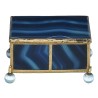 A box shaped like a casket, made of gold and blue metal
