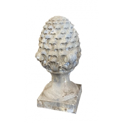 Carved stone pine cone