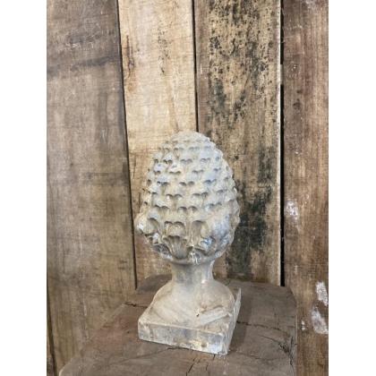 Carved stone pine cone
