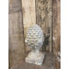 Carved stone pine cone