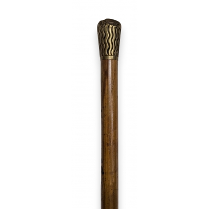 Brass walking stick with a knob and lines