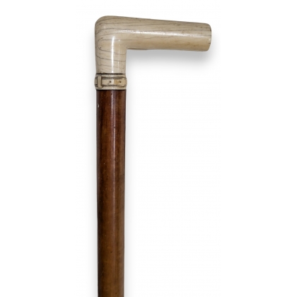 Walking stick with an ivory handle shaped like a belt