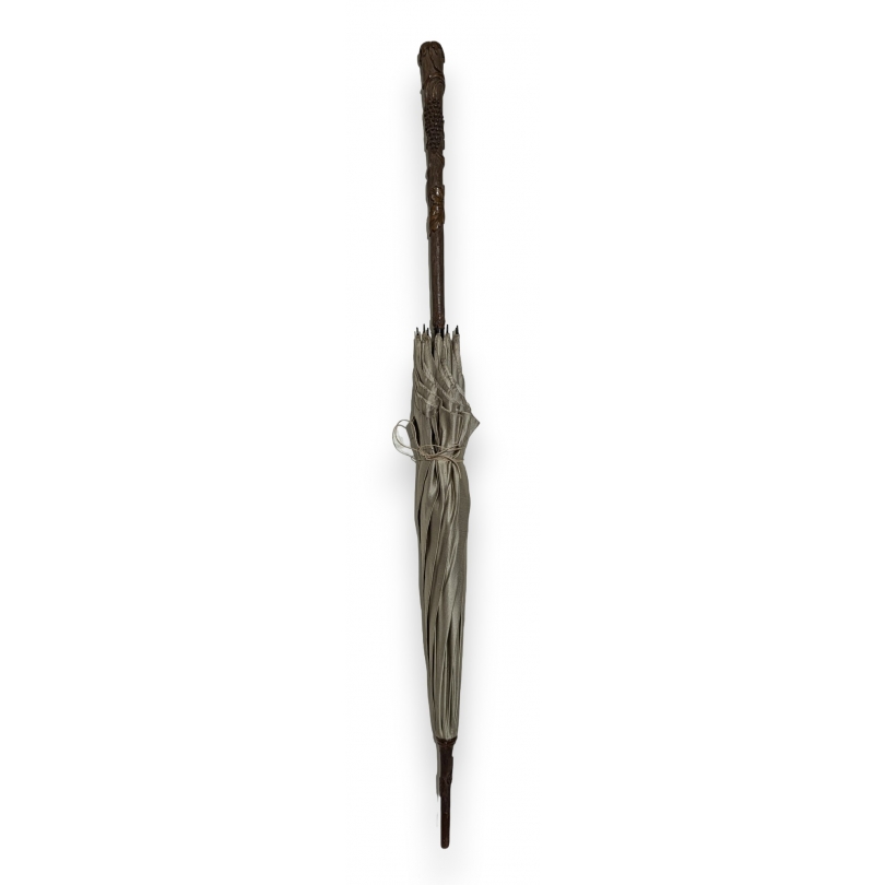 Parasol with a wooden handle carved with grapes