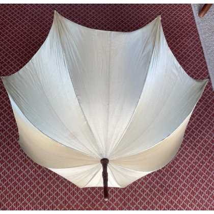 Parasol with a wooden handle carved with grapes