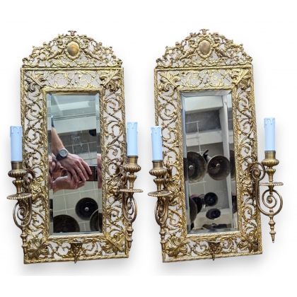 Pair of openwork brass mirror wall lights