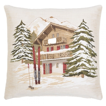 Coussin \"Chalet en hiver avec skis\"