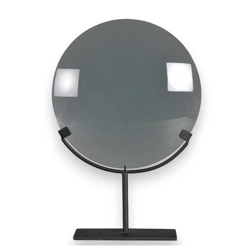 Large magnifying glass on a matt black metal stand