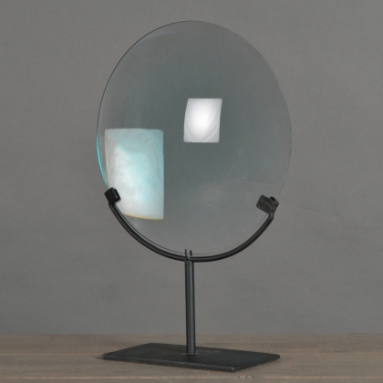 Large magnifying glass on a matt black metal stand