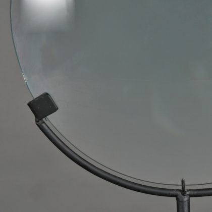 Large magnifying glass on a matt black metal stand