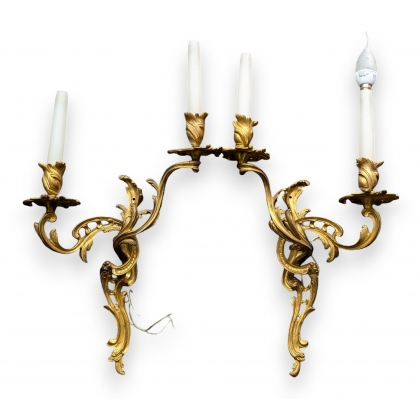 A pair of Louis XV-style wall lights with two lights