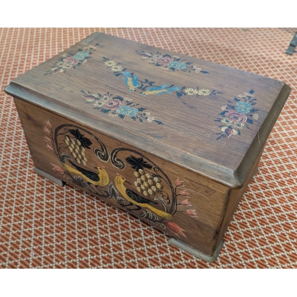 Music box with a painted bird design