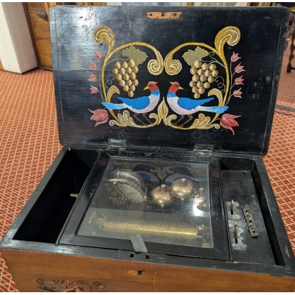 Music box with a painted bird design