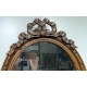 Miroir ovale style Louis XVI fronton noeud