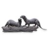 A pair of otters on a branch, cast in bronze