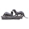 Couple de loutres sur une branche en bronze