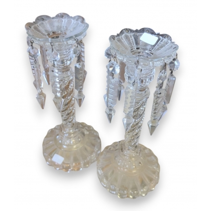 A pair of moulded glass candle holders from Portieux