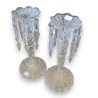 A pair of moulded glass candle holders from Portieux