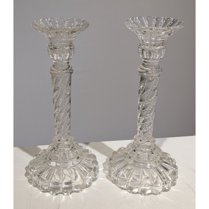 A pair of moulded glass candle holders from Portieux