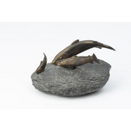 Bronze sculpture entitled ‘Three Trout’ on a stone