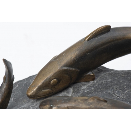 Bronze sculpture entitled ‘Three Trout’ on a stone