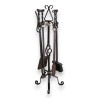  Garniture de cheminée en fer forgé sur  Moinat SA  - Antiquités décoration