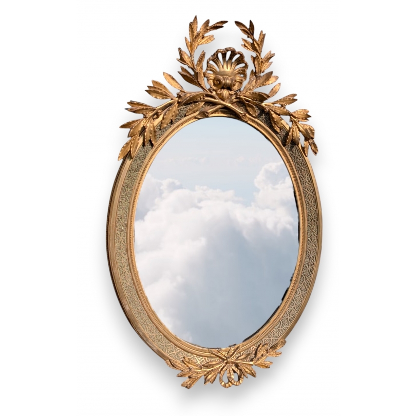 Grand miroir ovale Louis XVI doré