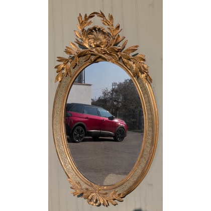Grand miroir ovale Louis XVI doré