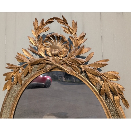 Grand miroir ovale Louis XVI doré