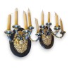 A pair of wall lights in gilded and blackened bronze