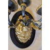 A pair of wall lights in gilded and blackened bronze