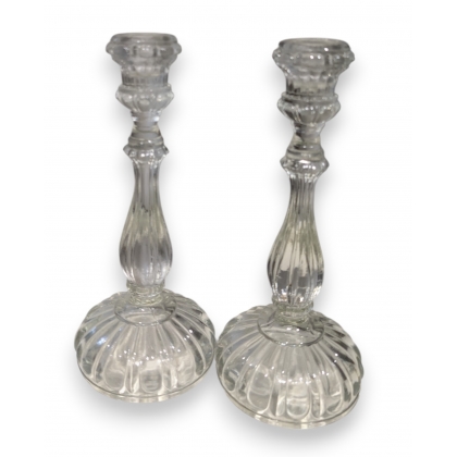 A pair of moulded glass candle holders