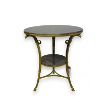 Pedestal table in the "Eagle-headed" in gilded bronze,