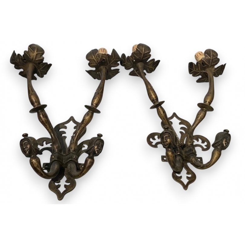 A pair of Renaissance-style bronze wall lights
