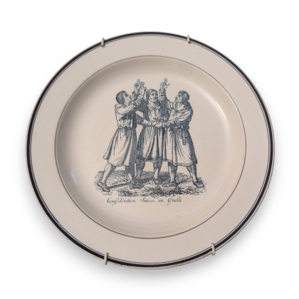 Assiette \"Grütli\" en faïence de Baylon