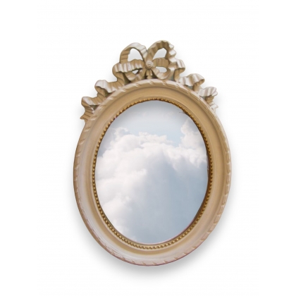Miroir ovale, cadre en bois laqué ivoire