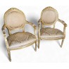 Paire de fauteuils style Louis XVI dorés